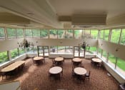 Thumbnail 7 of 28 - community room with tables and chairs