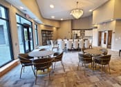 Thumbnail 13 of 27 - a large room with tables and chairs and a piano