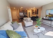 Thumbnail 2 of 27 - a living room with a couch and a table