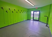 Thumbnail 22 of 27 - a large room with green lockers and a concrete floor