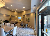 Thumbnail 14 of 27 - community room with tables and grand piano