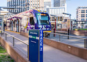 Thumbnail 30 of 39 - A train on the Green Line tracks at a station.