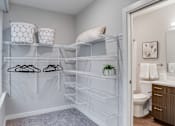 Thumbnail 12 of 39 - A white closet with a toilet in the bathroom.
