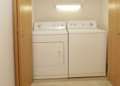 Thumbnail 18 of 28 - a washer and dryer in a laundry room