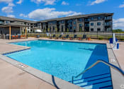 Thumbnail 1 of 37 - our apartments have a resort style pool with lounge chairs
