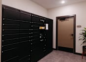 Thumbnail 25 of 37 - a row of black lockers in a room with an open door