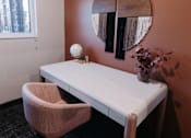 Thumbnail 29 of 37 - a desk and chair in a room with a mirror