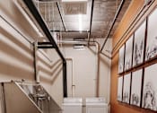 Thumbnail 19 of 37 - a large room with a sink and washing machines