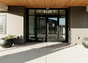 Thumbnail 34 of 37 - the front entrance of a building with glass doors