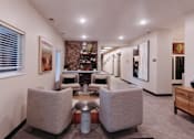 Thumbnail 22 of 37 - a living room with couches and chairs and a bar in the corner