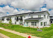 Thumbnail 36 of 37 - A row of houses with a red fire hydrant in front of the first house.