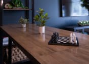 Thumbnail 9 of 29 - a dining room with a wooden table and two lights