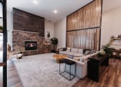 Thumbnail 12 of 29 - a living room with a couch and a fireplace