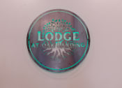Thumbnail 29 of 29 - a metal button with a tree and the words lodges at oak landing on it