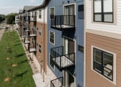 Thumbnail 28 of 29 - a row of apartment buildings with balconies on the side of them