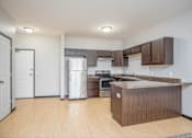 Thumbnail 3 of 36 - A kitchen with a wooden island and stainless steel appliances.