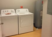 Thumbnail 20 of 36 - Two washing machines in a laundry room.