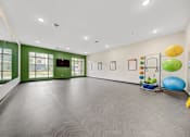 Thumbnail 29 of 36 - A room with a grey floor and a green wall.