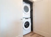 Thumbnail 21 of 22 - A white washing machine at Alta Apartments, Pewaukee, 53186
