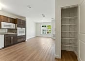 Thumbnail 9 of 66 - A kitchen with white appliances and wooden cabinets.