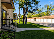 Thumbnail 24 of 32 - A row of houses with a tree in front of them.