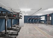 Thumbnail 6 of 23 - A row of basketball hoops are lined up in a gym.