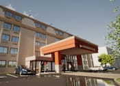 Thumbnail 1 of 23 - A modern building with a red awning and cars parked in front.