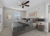 Thumbnail 2 of 7 - A bedroom with a bed, nightstands, and a ceiling fan.