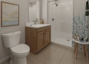 Thumbnail 2 of 11 - A white toilet sits next to a sink in a bathroom.