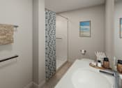 Thumbnail 10 of 11 - A bathroom with a white sink and a blue shower curtain.