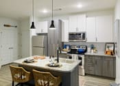 Thumbnail 3 of 12 - Kitchen with an island at The Eddy at Riverview, Smyrna, 30126