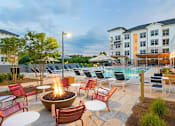 Thumbnail 6 of 12 - Swimming pool with chairs at The Eddy at Riverview, Georgia