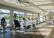 Thumbnail 7 of 12 - Gym with big windows and cardio equipment at The Eddy at Riverview, Georgia, 30126