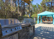 Thumbnail 6 of 23 - A KRS outdoor grill is on a stone slab.