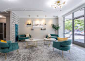Thumbnail 14 of 23 - Lobby with chairs and tables and a large window at 500 Fifth Apartments, Nashville, TN, 37219