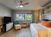 Thumbnail 19 of 23 - Bedroom with a bed and a ceiling fan at 500 Fifth Apartments, Tennessee