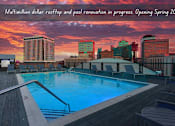 Thumbnail 1 of 23 - A pool area with a caption about a multimillion dollar renovation opening in spring 2025.