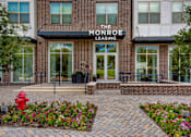 Thumbnail 19 of 47 - Front of the leasing building with a red fire hydrant at The Monroe Apartments, Austin, 78741