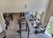 Thumbnail 44 of 47 - an overhead view of a gym with weights and cardio equipment at The Monroe Apartments, Austin, TX, 78741