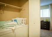 Thumbnail 13 of 14 - In-unit laundry at Emory Woods Apartments, Durham, NC.