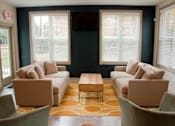 Thumbnail 2 of 14 - Living room with two couches at Emory Woods Apartments, Durham, NC, 28205..