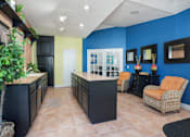 Thumbnail 9 of 36 - Lobby with a blue wall and orange chairs  at Cape Landing, Myrtle Beach, 29588
