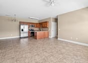 Thumbnail 24 of 39 - A kitchen with a living room access, microwave, and oven. at The Lory of Greenway Village Apartments, Ky