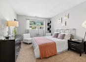 Thumbnail 5 of 51 - Bedroom with modern furniture and natural light at The Palms Apartments, South Carolina