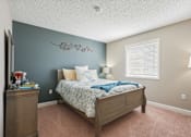Thumbnail 31 of 36 - Bedroom with a bed and a dresser and a window  at Cape Landing, Myrtle Beach, South Carolina