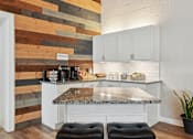 Thumbnail 5 of 26 - Kitchen with white cabinets and a marble counter top  at Emerald Bay, Charlotte, 28217