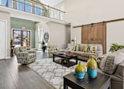 Thumbnail 27 of 39 - Clubhouse seating area with sliding barn doors at The Lory of Greenway Village Apartments, Kentucky, KY