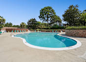 Thumbnail 13 of 51 - Large swimming pool with brick wall surround at The Palms Apartments, South Carolina, 29407