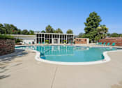 Thumbnail 14 of 51 - Outdoor swimming pool with midcentury modern clubhouse at The Palms Apartments, Charleston, South Carolina