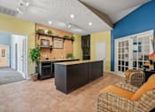 Thumbnail 10 of 36 - Kitchen with an island in the middle of a living room  at Cape Landing, Myrtle Beach, SC